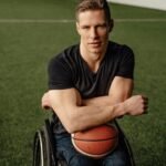 Coach in wheelchair holding a basketball