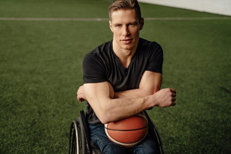 Coach in wheelchair holding a basketball