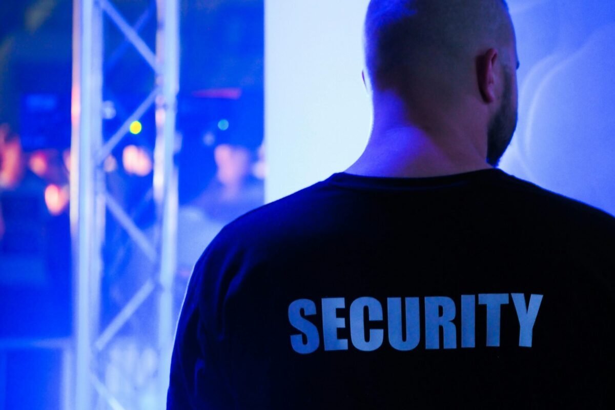 Back of a person with the word Security on their shirt