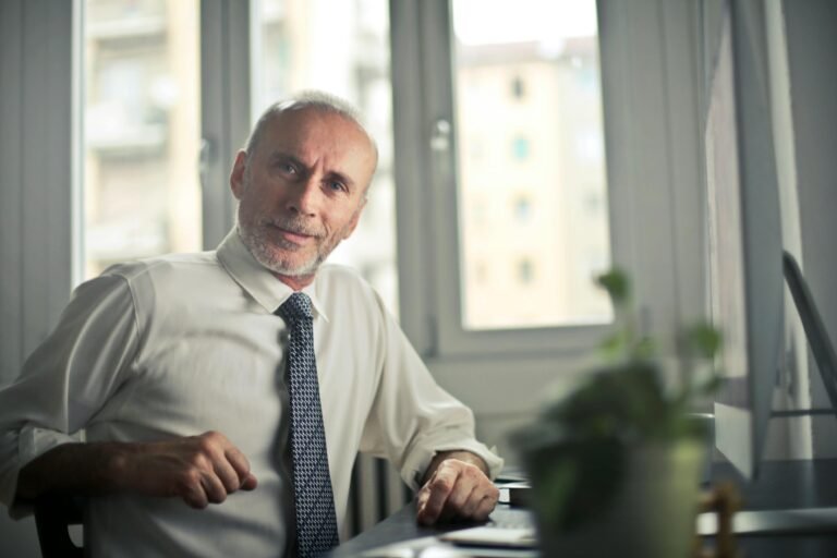Older person sitting at desk