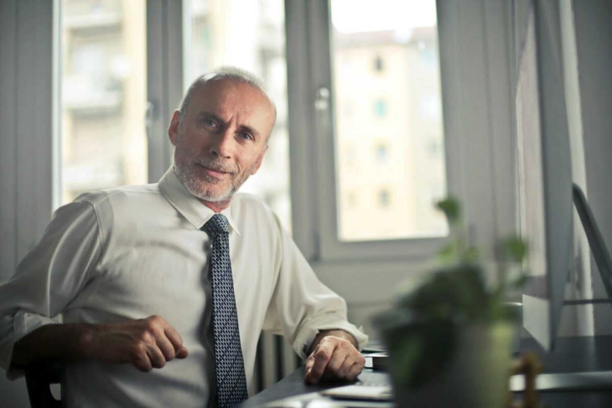 Older person sitting at desk