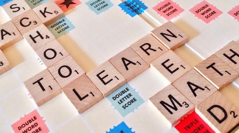 LEARN and other school related words spelled out with Scrabble pieces