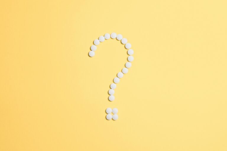 Question make made of white dots on yellow background.