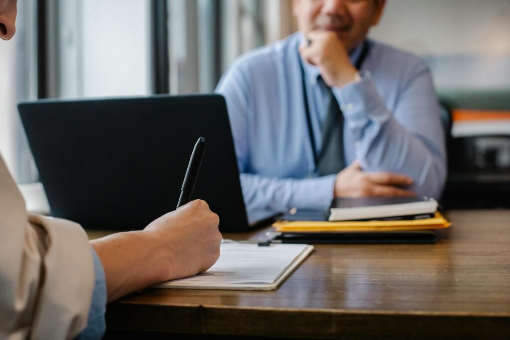 Two people in interview or meeting setting