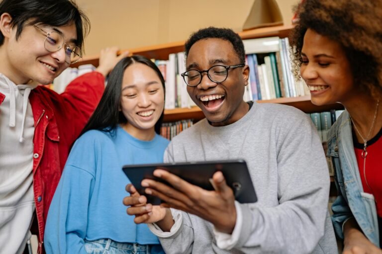 Group of high school students around tablet computer
