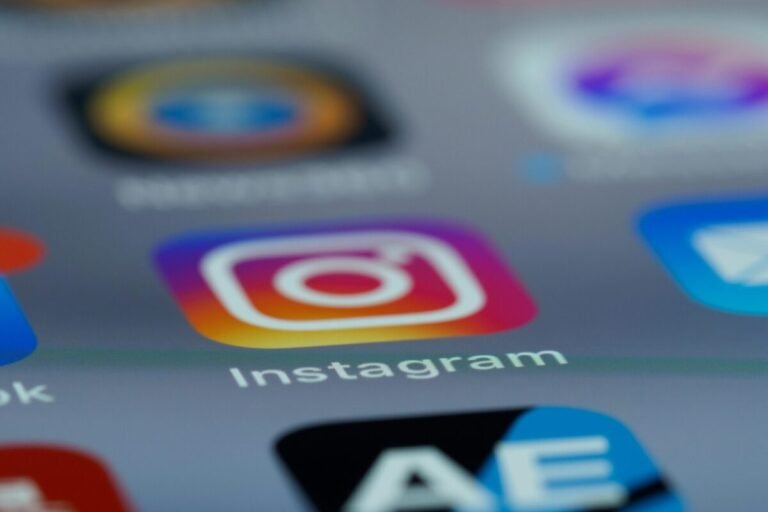 Digital phone with social media icons - Instagram is highlighted.