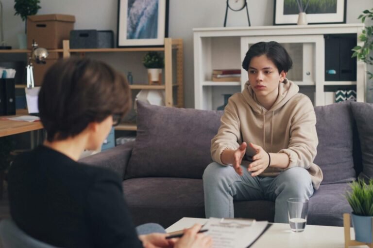 Student on Sofa speaking to an adult