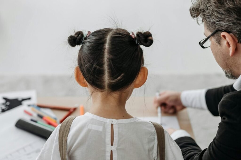 School counselor working with child.