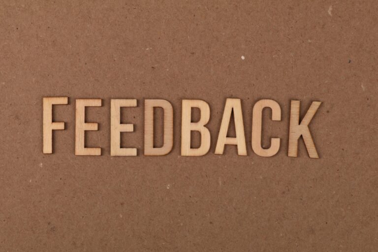 Cork board with the word Feedback on it.