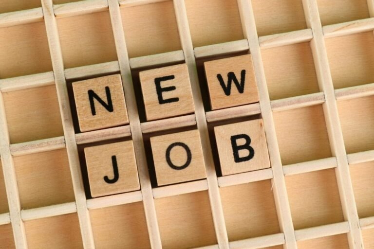 Board with the phrase "New Job" spelled out.