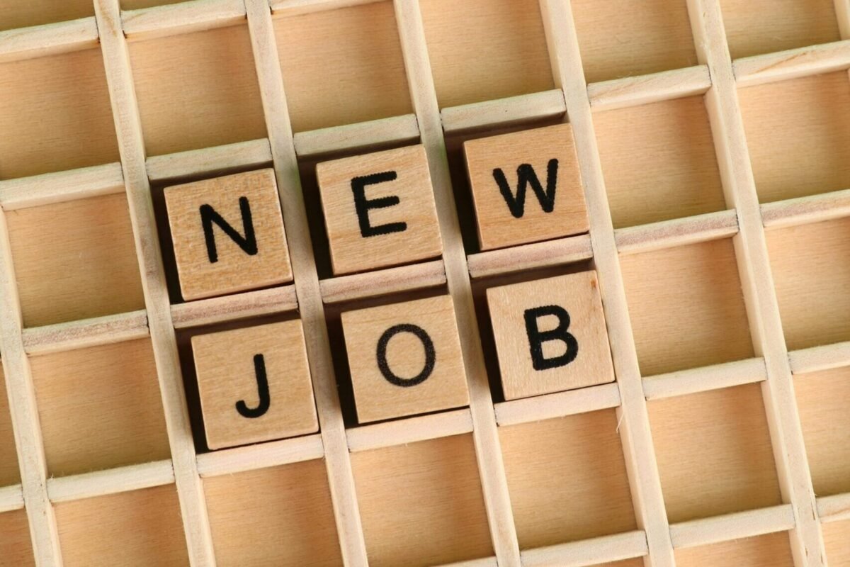 Board with the phrase "New Job" spelled out.