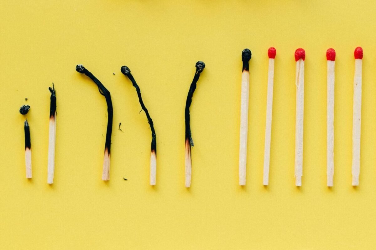 Row of matches at different levels of having been burned.
