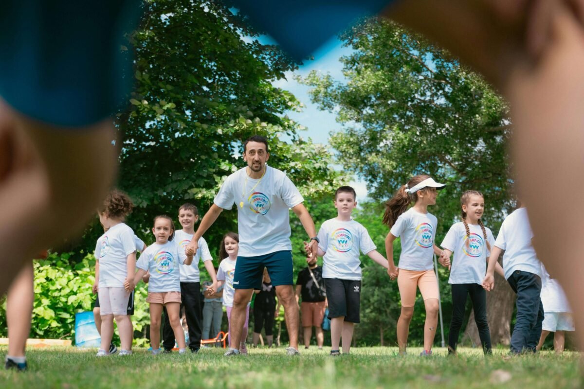 Summer camp director interacting with summer campers.