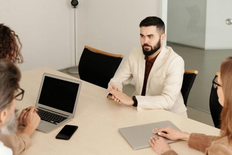 Person being interviewed for a school job by a hiring committee.