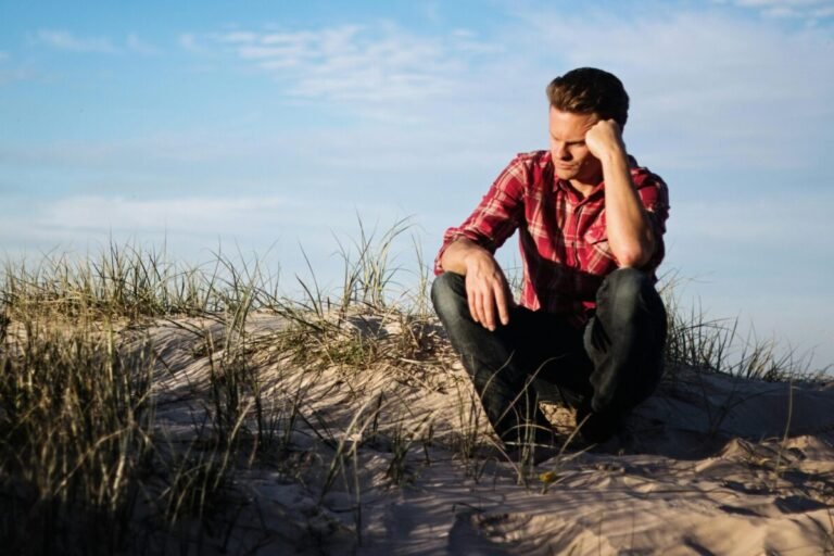Person sitting on hiking trail wondering if their mentor is right for them.