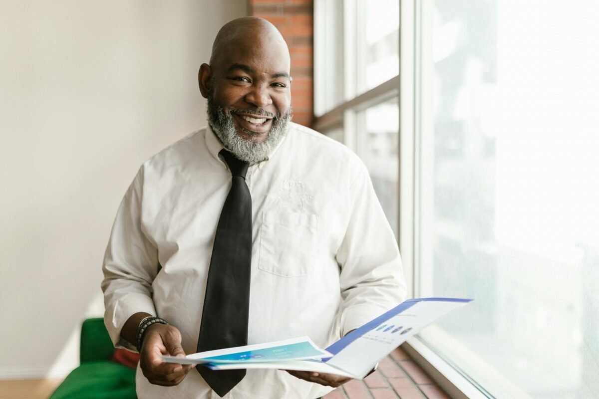 School administrator reviewing his school leadership resume.