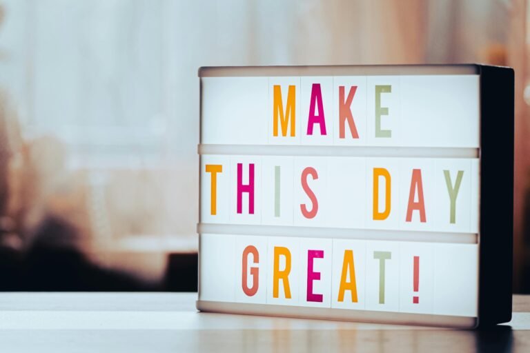 Board that reads "make this day great"