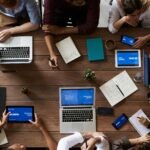 Group of people using technology to build a website